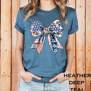 Distressed patriotic bow graphic in red white and blue with stars stripes and mixed animal print patterns perfect for USA 4th of July shirts women’s Independence Day tees America flag summer outfits cute freedom celebration apparel or red white blue patriotic shirt for parades BBQs and holiday events