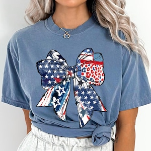 Patriotic bow shirt design with red white and blue colors stars and stripes perfect for 4th of July womens Independence Day summer outfit