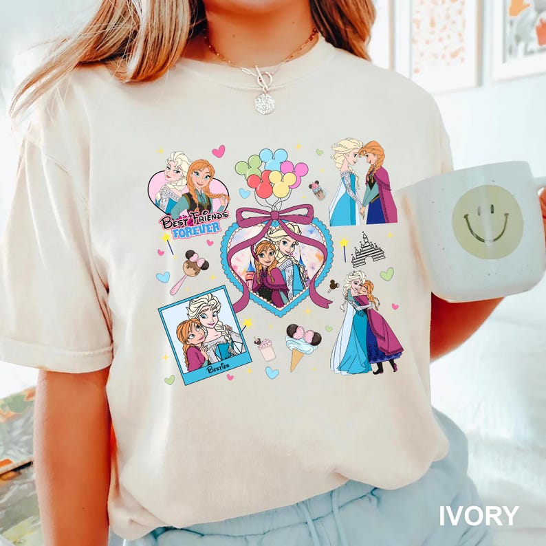 Cute coquette-style Disney Frozen shirt featuring Elsa and Anna with hearts, bows, and pastel icons, ideal for sisters and best friends.