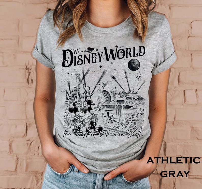 Retro Walt Disney World shirt with vintage-style illustrations of Magic Kingdom, Epcot, Hollywood Studios, and Animal Kingdom featuring classic Disney icons and park landmarks in a nostalgic line-art design.