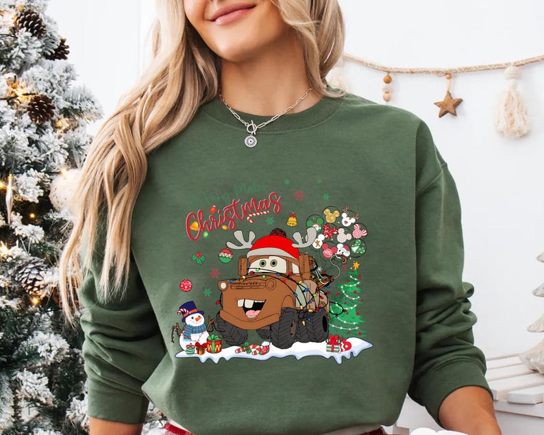 Mater Christmas holiday T-shirt from Disney Cars, featuring festive decorations, perfect for Disney trips, Christmas gifts, and holiday events.