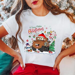 A Very Mater Christmas shirt featuring Disney Cars character Mater with Christmas lights and festive decorations, perfect holiday gift for Disney fans.