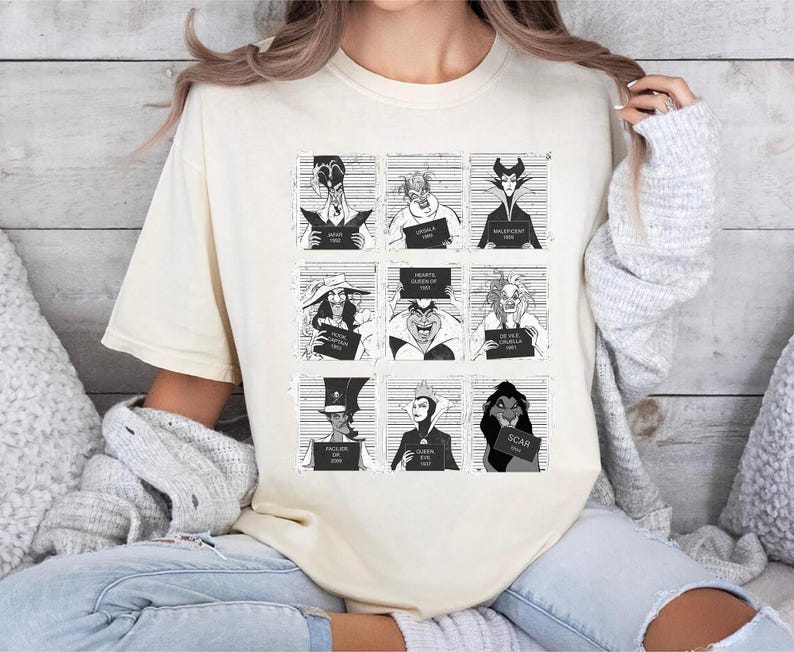 Retro Disney Villains mugshot shirt featuring lineup of Evil Queen, Ursula, Jafar, Scar, Maleficent, Cruella, Captain Hook, Dr. Facilier, and Queen of Hearts, perfect for Halloween, Disney villain fans, and Magic Kingdom group trips.