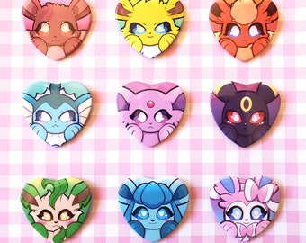 May include: Nine heart-shaped pins featuring different Pokemon characters. The pins are colorful and feature various Pokemon, including Eevee, Vaporeon, Jolteon, Flareon, Espeon, Umbreon, Glaceon, Leafeon, and Sylveon.