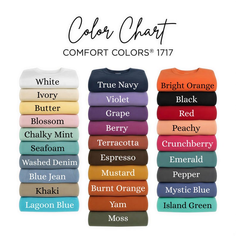 May include: A Comfort Colors 1717 color chart featuring three vertical stacks of folded t-shirts in various shades. The text includes White, Ivory, Butter, Blossom, Chalky Mint, Seafoam, Washed Denim, Blue Jean, Khaki, Lagoon Blue, True Navy, Violet, Grape, Berry, Terracotta, Espresso, Mustard, Burnt Orange, Yam, Moss, Bright Orange, Black, Red, Peachy, Crunchberry, Emerald, Pepper, Mystic Blue, and Island Green.