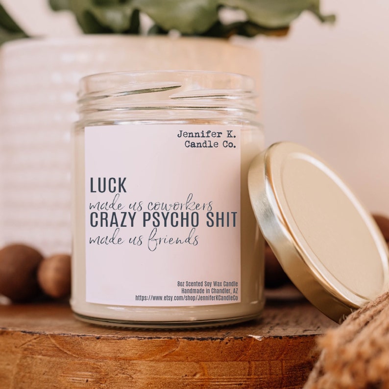 Scented Soy Wax Candle With The Text Luck Made Us Coworkers Crazy Psycho Shit and Made in Small Batches in Chandler, Arizona.