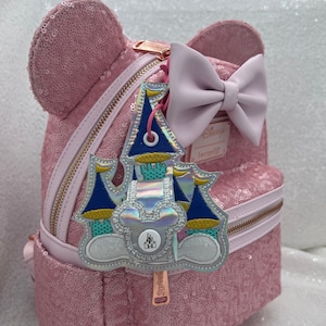 Holographic castle mouse ears holder.