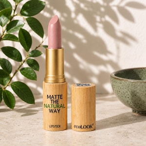 May include: A lipstick with a light mauve matte bullet and a cylindrical bamboo casing. The casing features the black text MATTE THE NATURAL WAY and the word LIPSTICK, with the brand name ecoLOOK printed on the matching bamboo cap.