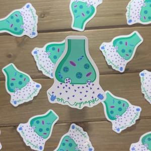 May include: A set of 10 stickers featuring a green cartoon illustration of a vesicle with the text "oh synapse" underneath. The vesicle is filled with small purple and blue circles and is releasing small purple triangles.