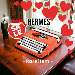 Machine à écrire Hermes Baby Orange vintage - Votre compagnon d’écriture parfait !