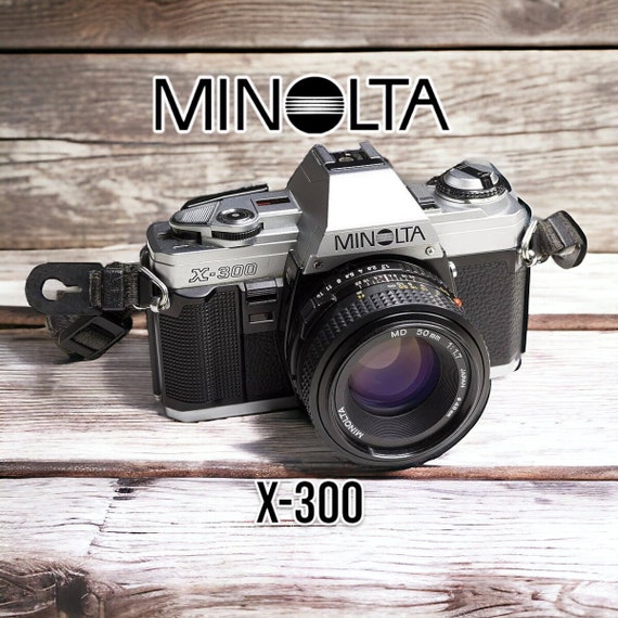Appareil Photo Argentique Minolta X-300 35 Mm - Boîtier Argenté, Occasion, Testé Et Fonctionnel