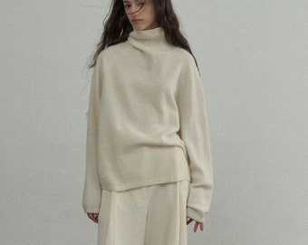 Wool Roll Neck Jumper in Cream