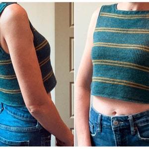 May include: A teal and gold striped knit crop top. The sleeveless top features horizontal gold stripes across the chest and torso. The top is paired with blue denim jeans.