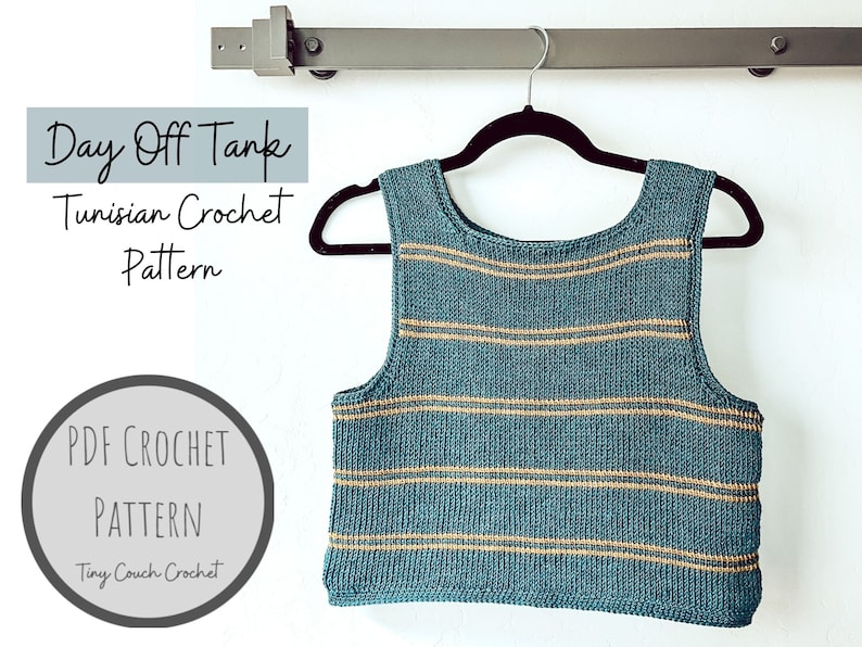 May include: A teal and tan striped tank top hangs on a black hanger. The tank top is made with a Tunisian crochet pattern. Text on the image reads "Day Off Tank Tunisian Crochet Pattern" and "PDF Crochet Pattern Tiny Couch Crochet."