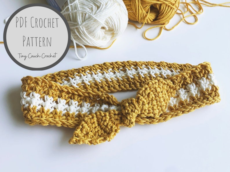 May include: A crocheted headband with a knotted bow in mustard yellow and white yarn. The headband is made with a simple stitch pattern and has a striped design. The image includes the text "PDF CROCHET PATTERN Tiny Couch Crochet".