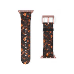 May include: A watch strap featuring a tortoiseshell design in brown and orange hues. The strap has rose gold-coloured hardware, including the buckle and connectors. The watch strap is displayed against a white backdrop.