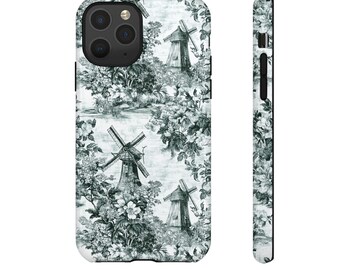 Puede incluir: Una funda para iPhone blanca con un patrón en blanco y negro de molinos de viento y flores. La funda tiene un recorte para el objetivo de la cámara.