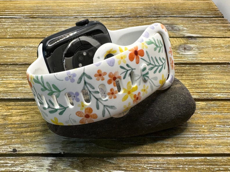 Add a touch of spring to your smartwatch with our Wildflower Print Watch Band for Apple, Samsung, and Fitbit. Stylish and vibrant floral design. Shop now!