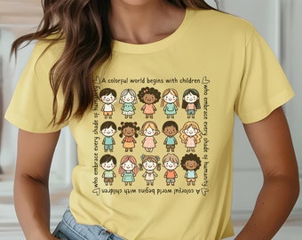 May include: A yellow t-shirt with a graphic of children of different races and ethnicities. The text on the shirt reads "A colorful world begins with children who embrace every shade of humanity."