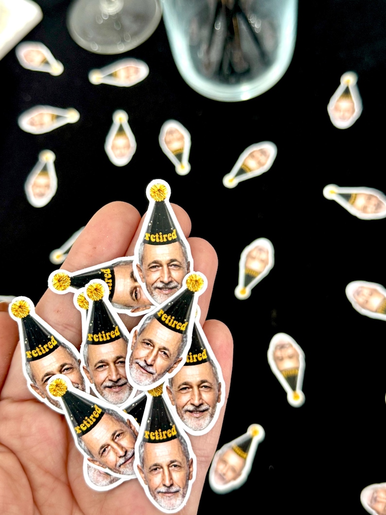 May include: A collection of stickers featuring a smiling man wearing a black and gold party hat with the word "retired" printed on it. Scattered around are champagne bottle stickers. The stickers are on a black background.