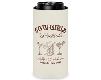 May include: A beige can cooler with a brown graphic of a cowboy hat, boots, and cocktails. The text "Cowgirls & Cocktails" is at the top of the cooler. The text "Molly's Bachelorette Nashville | June 2025" is at the bottom of the cooler.