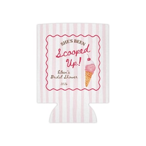 May include: A white and pink striped can cooler with a decorative pink frame. The frame contains the text "She's Been Scooped Up!" and "Eileen's Bridal Shower 2026" with an illustration of an ice cream cone.