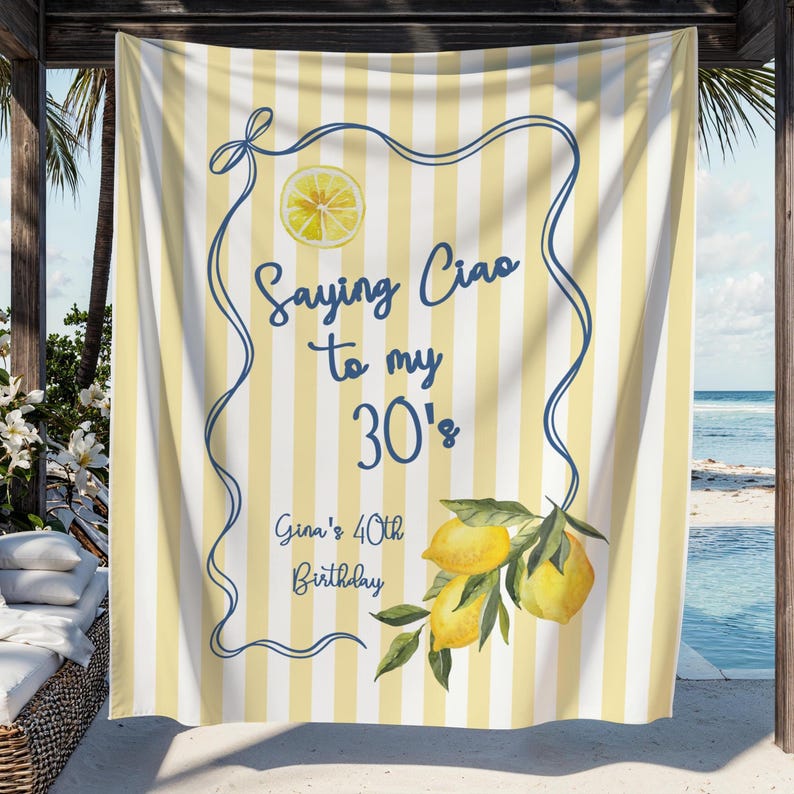 May include: A yellow and white striped banner with a blue border and text that reads "Saying Ciao to my 30's". The banner also includes a lemon illustration and the text "Gina's 40th Birthday".