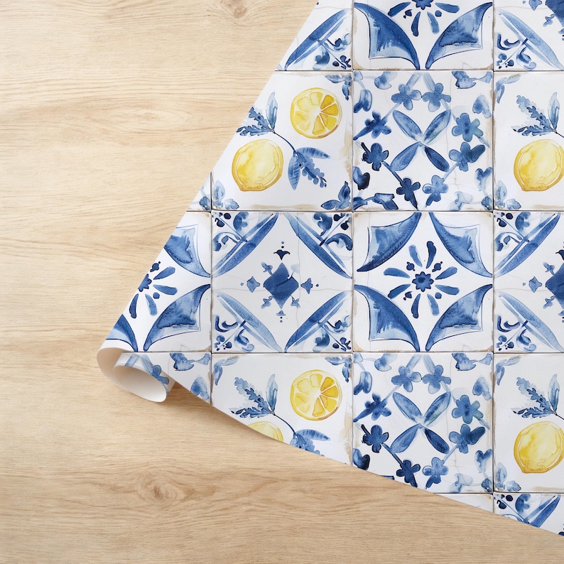 May include: Blue and white patterned wrapping paper with yellow lemons. The pattern resembles traditional Portuguese tiles.