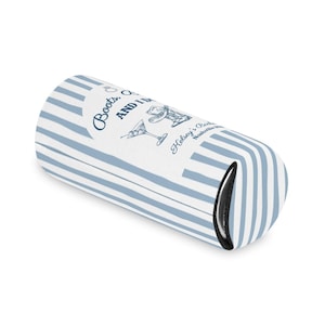 May include: A blue and white striped beverage insulator with the text "Boots, and I'm" and "Helsey's Bar Nashville" printed on it. The insulator has a black interior and a design of a cocktail glass and a woman's hat.