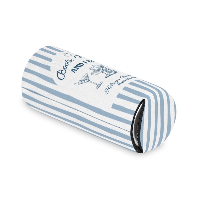 May include: A blue and white striped beverage insulator with the text "Boots, and I'm" and "Helsey's Bar Nashville" printed on it. The insulator has a black interior and a design of a cocktail glass and a woman's hat.