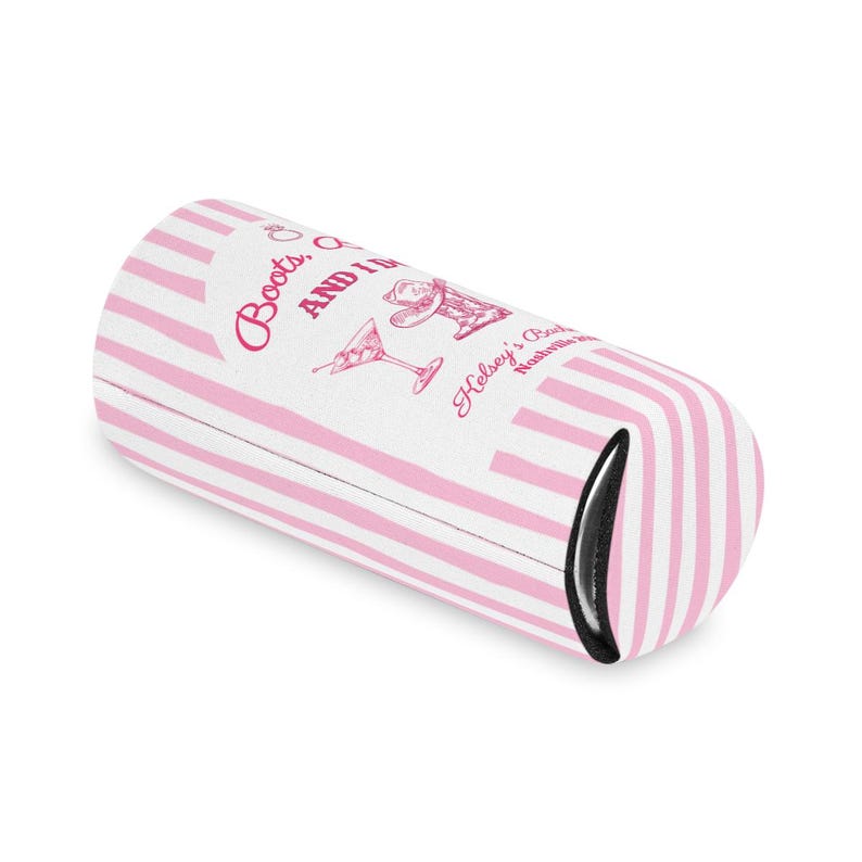 May include: A pink and white striped can cooler with the text "Boots, Q and I" and "Halsey's Boots Nashville" in a script font. The cooler features illustrations of a cowboy hat, a martini glass, and a cowboy boot.