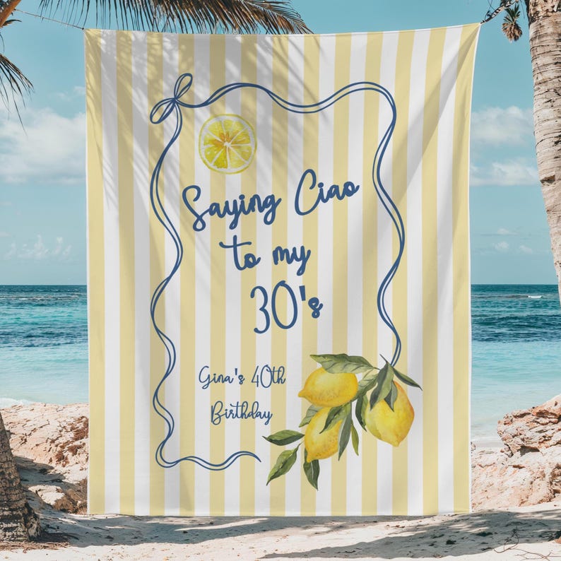 May include: Beach towel with a yellow and white striped background. The towel has a blue border with the text "Saying Ciao to my 30's" and "Gina's 40th Birthday". A lemon illustration is in the center and a lemon branch is at the bottom.