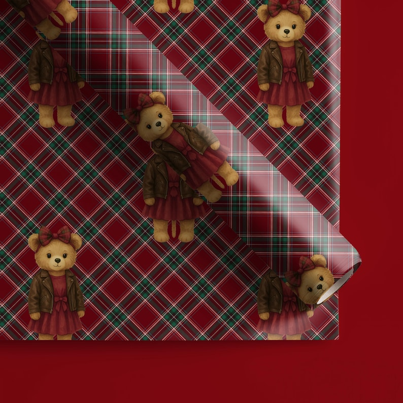 May include: Wrapping paper with a repeating pattern of teddy bears wearing red dresses and brown jackets. The background is a red, green, and white plaid design. The paper is partially rolled, revealing a solid red background.