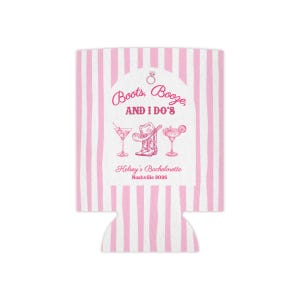 May include: A pink and white striped can cooler with the text "Boots, Booze, AND I DO'S" in pink. Below the text are illustrations of a martini, cowboy boot, and margarita. The text "Kelsey's Bachelorette Nashville 2026" is also included.