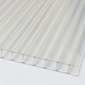 May include: Clear corrugated plastic sheet with a ribbed texture. The sheet is translucent and has a slight wave pattern.