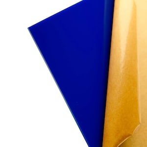 May include: A sheet of blue acrylic with a protective brown paper backing.