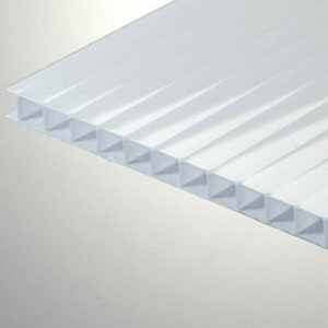 May include: White corrugated plastic sheet with a ribbed texture. The sheet is translucent and has a smooth surface.