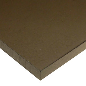 May include: A close-up of a dark brown rectangular sheet of material. The material has a smooth, slightly textured surface.