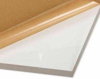 May include: A clear acrylic sheet with a protective brown paper backing. The sheet is smooth and has a slight sheen.