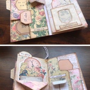 May include: A vintage-style scrapbook with floral patterned paper and decorative elements. The scrapbook has several pockets and flaps, including a pocket labeled "No 9823" and a flap labeled "No 21 Rue". The scrapbook also features a clock face with Roman numerals and a small envelope with the word "beautiful" written on it.