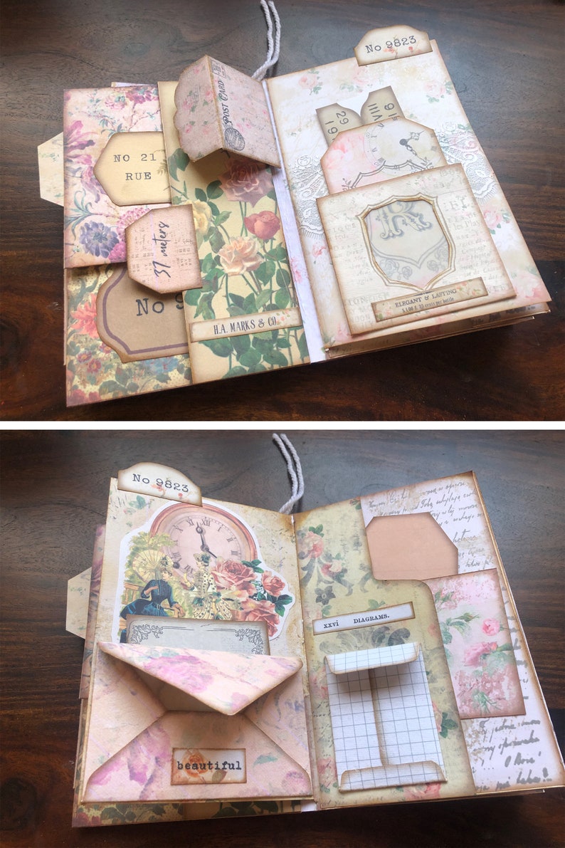 May include: A vintage-style scrapbook with floral patterned paper and decorative elements. The scrapbook has several pockets and flaps, including a pocket labeled "No 9823" and a flap labeled "No 21 Rue". The scrapbook also features a clock face with Roman numerals and a small envelope with the word "beautiful" written on it.