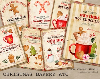 May include: A set of printable Christmas bakery themed digital art cards. The cards feature illustrations of gingerbread cookies, hot chocolate, and candy canes. The text on the cards includes "Mrs. Claus Bakery", "Gingerbread", "Old Fashioned Hot Chocolate", "Candy Cane", and "Egg Nog".