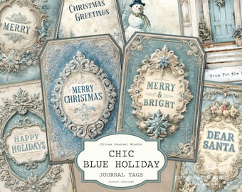 Pode incluir: Uma coleção de etiquetas de diário de férias azuis e creme. As etiquetas apresentam molduras ornamentadas com saudações de feriados como "Feliz Natal" e "Boas Festas". As palavras "Chic Blue Holiday Journal Tags" também são visíveis.