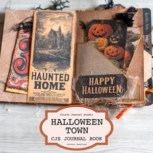 Op de afbeelding: Open Halloween-thema dagboek. Eén pagina toont een vintage illustratie van een spookhuis met de woorden "HAUNTED HOME". De tegenoverliggende pagina heeft pompoen illustraties en de woorden "HAPPY HALLOWEEN."
