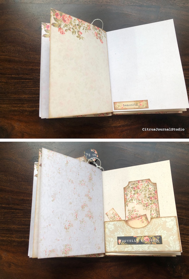 May include: Open vintage journal with floral patterned pages. The left page has a floral border and the right page has a small tag with the word "beautiful" on it. The next page has a floral patterned pocket with a tag that says "nouvelle edition".