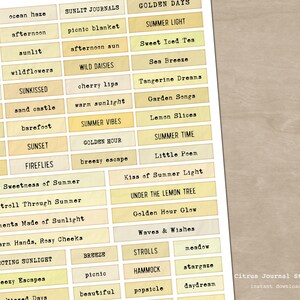 May include: A sheet of paper with various rectangular labels featuring summer-themed words in a vintage typewriter font. The labels are in shades of yellow and beige. Text includes "Summer Vibes," "Golden Hour," and "Sweet Iced Tea."