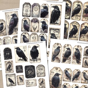 May include: Sheets of vintage-style paper ephemera featuring illustrations of crows and numbers. The tags and labels have a distressed, aged appearance with a muted colour palette of black, grey, and cream. The text "CitrusJournalStudio on Etsy" is visible.