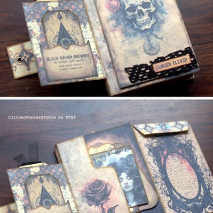 May include: A handmade, multi-layered, paper journal with a vintage aesthetic. The cover features a skull with a clock face, roses, and the text "Cursed Elixir". The inside pages feature a black rose, a woman's face, and a black raven brewery logo.