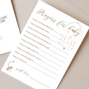 Puede incluir: Dos tarjetas imprimibles para un baby shower. La primera tarjeta dice "Oraciones para el bebé. Toma una tarjeta y por favor comparte tus oraciones para nuestro bebé. ¡Gracias!" La segunda tarjeta dice "Oraciones para el bebé" y tiene una lista de oraciones para el bebé.