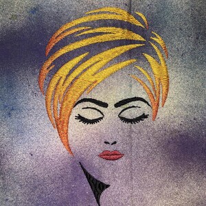 May include: Embroidered image of a woman with closed eyes and a short, blonde hairstyle. The background is a textured, purple and yellow gradient.